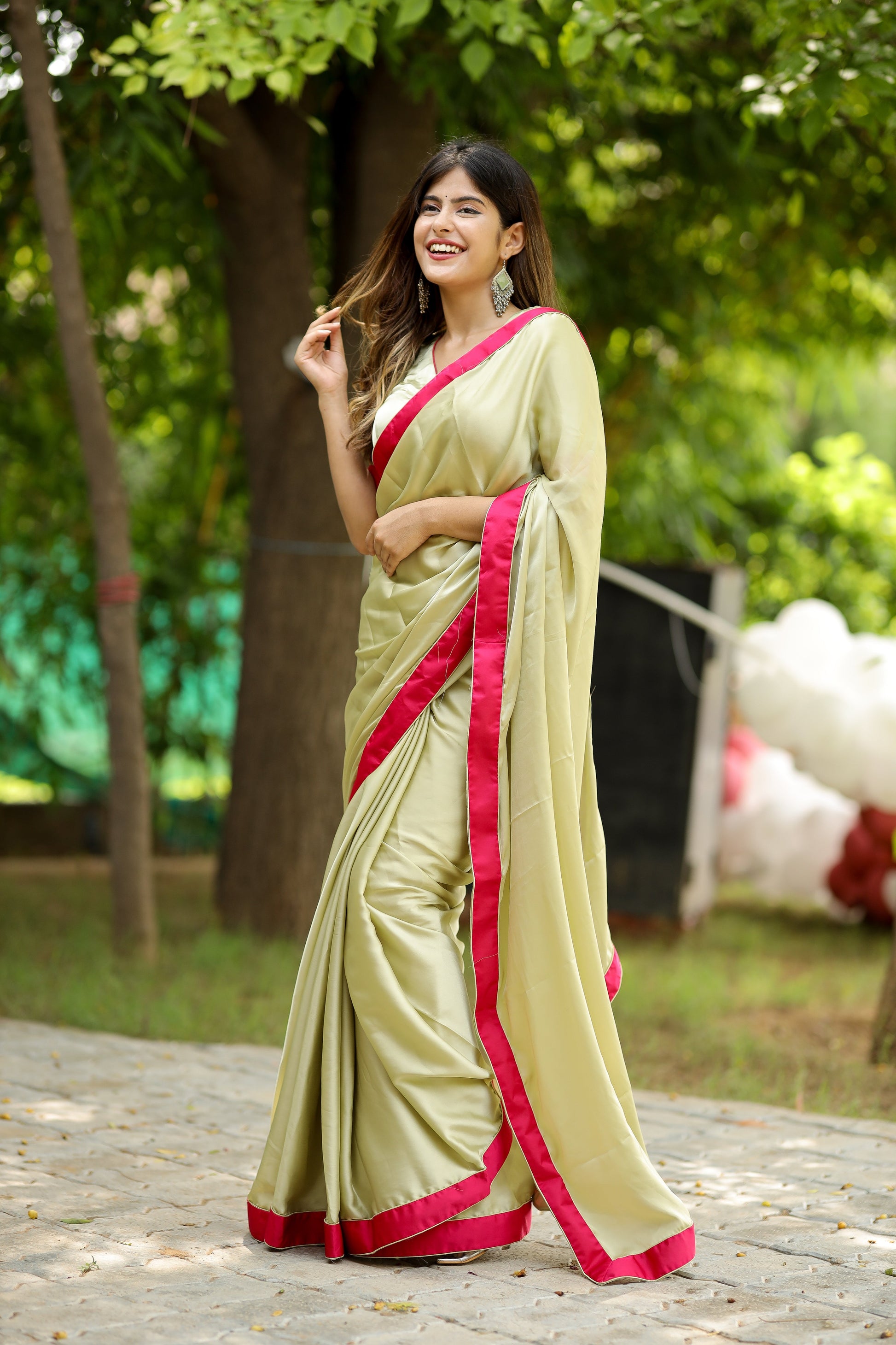 Captivating Green Light Satin Crepe Saree Rani Satin Border