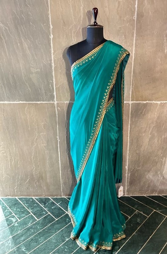 Emerald Green Crepe Silk Saree with Metal Embellishments