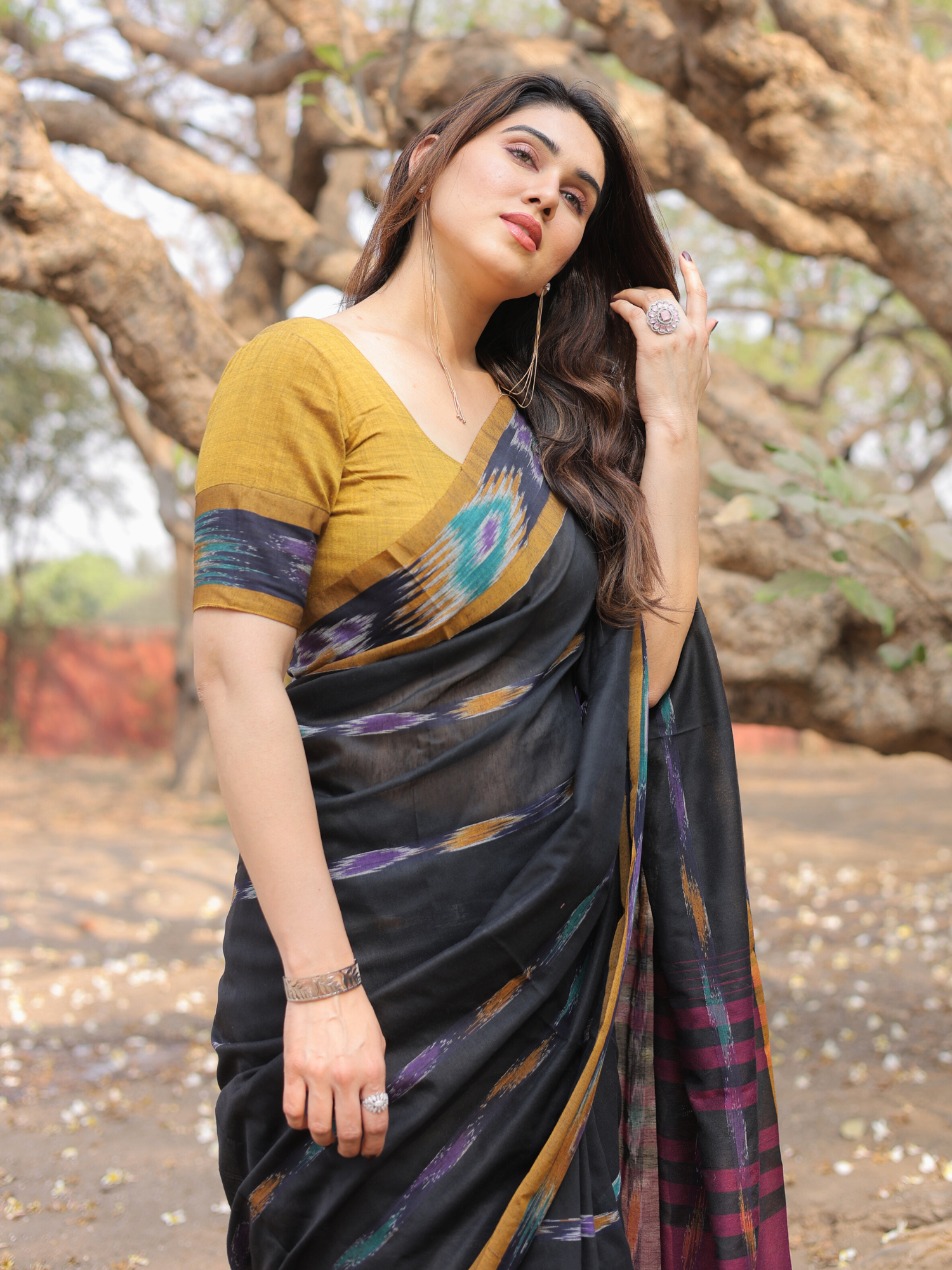 Darsh black ikat weave saree with contrast blouse