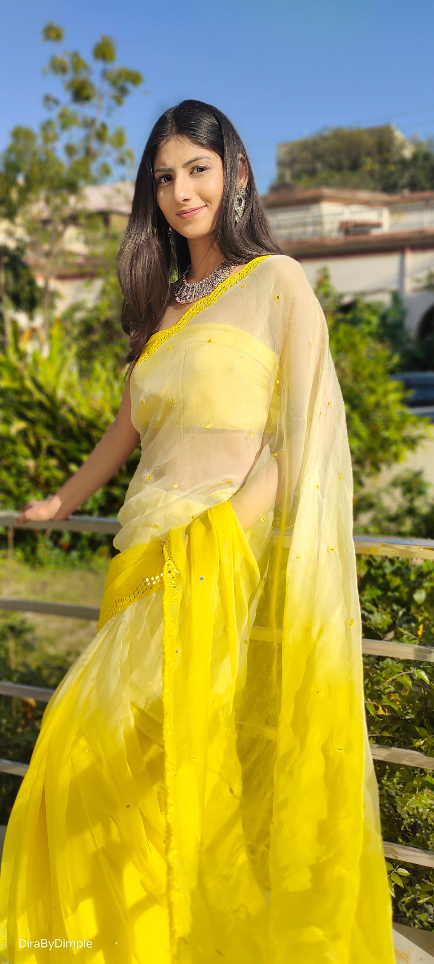 Mesmerizing Yellow Chiffon Saree with Mirror Handwork