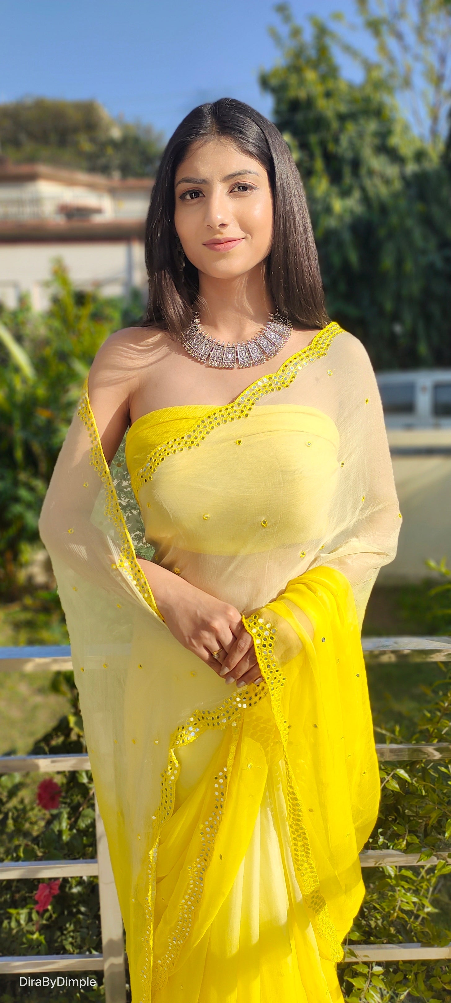 Mesmerizing Yellow Chiffon Saree with Mirror Handwork