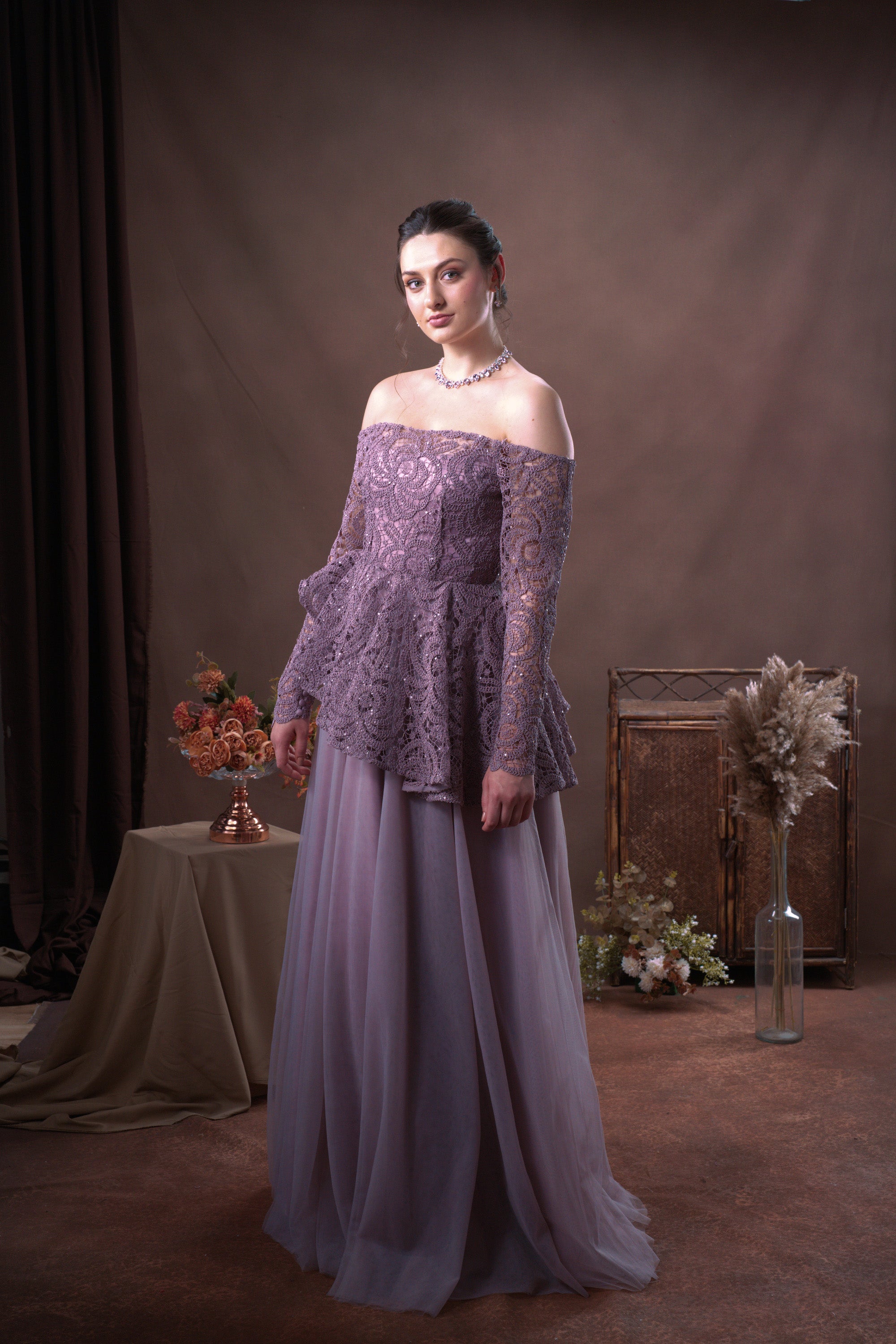 Gown with subtle detailing on bodice and smooth skirt
