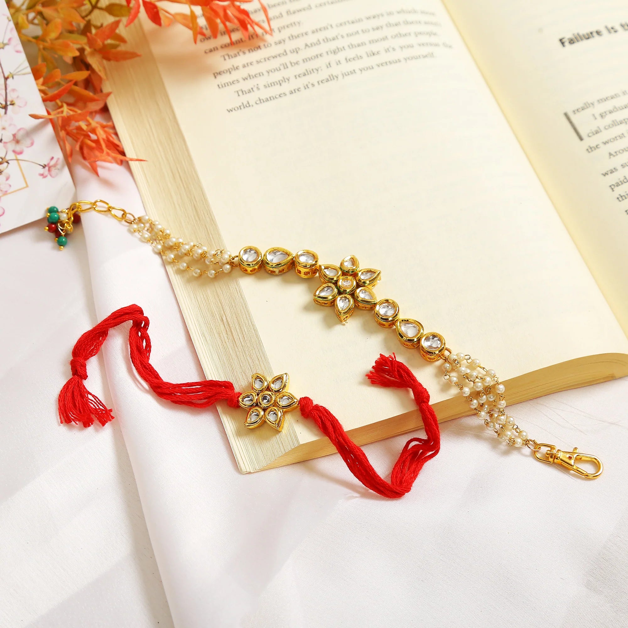 Set of 2 - Gold-Toned Kundan Embellished rakhi & floral lumba set