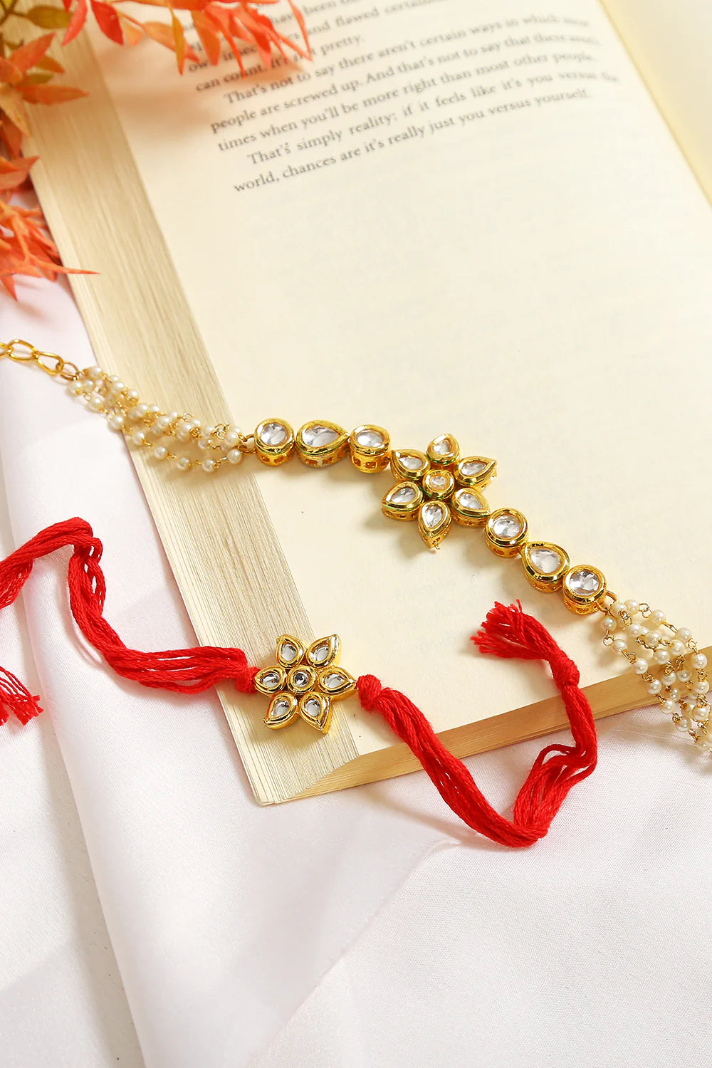 Set of 2 - Gold-Toned Kundan Embellished rakhi & floral lumba set