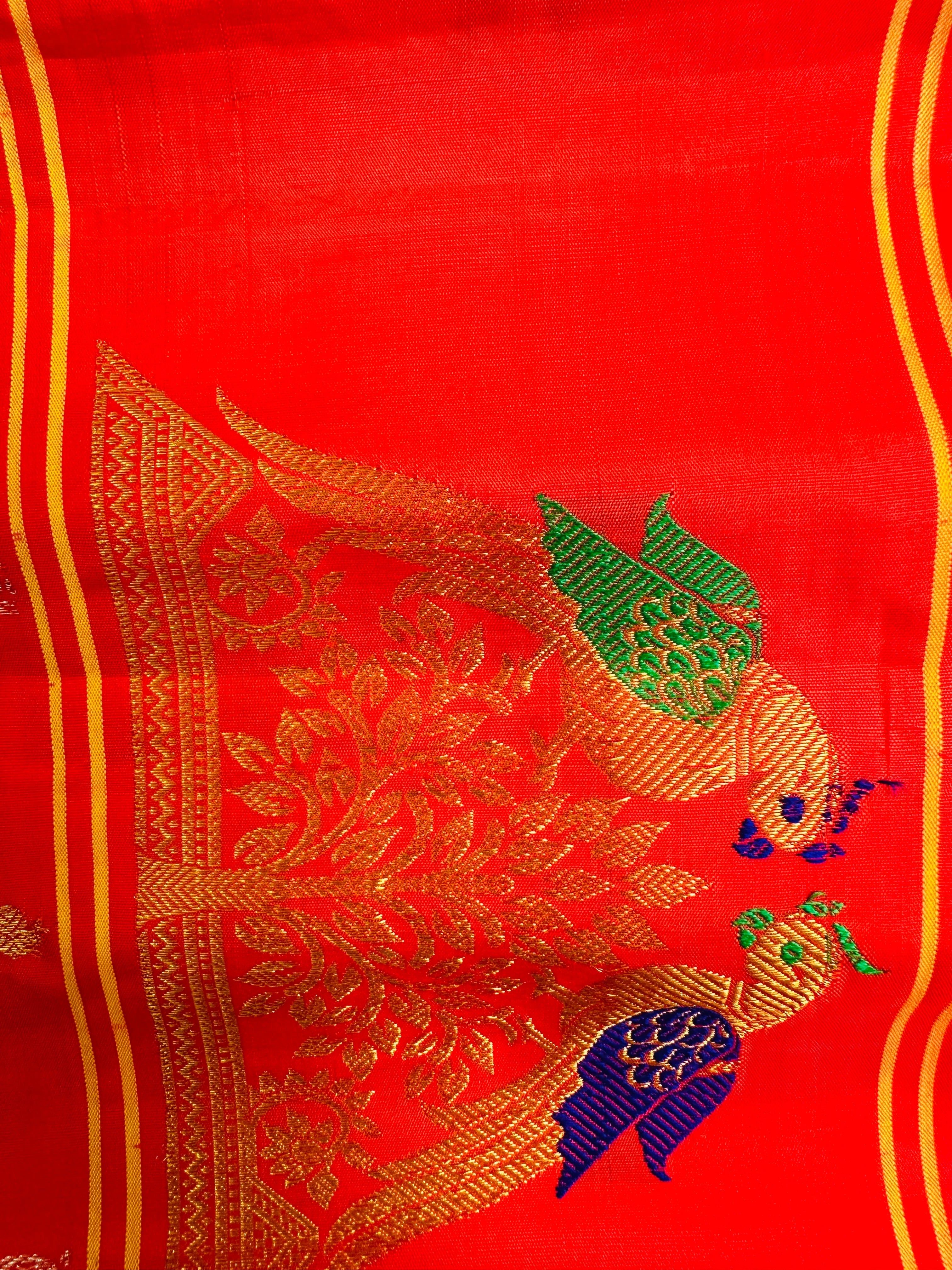 Radiant Orange Gadwal Pattu Saree Gold Zari Parrot Motifs Religious