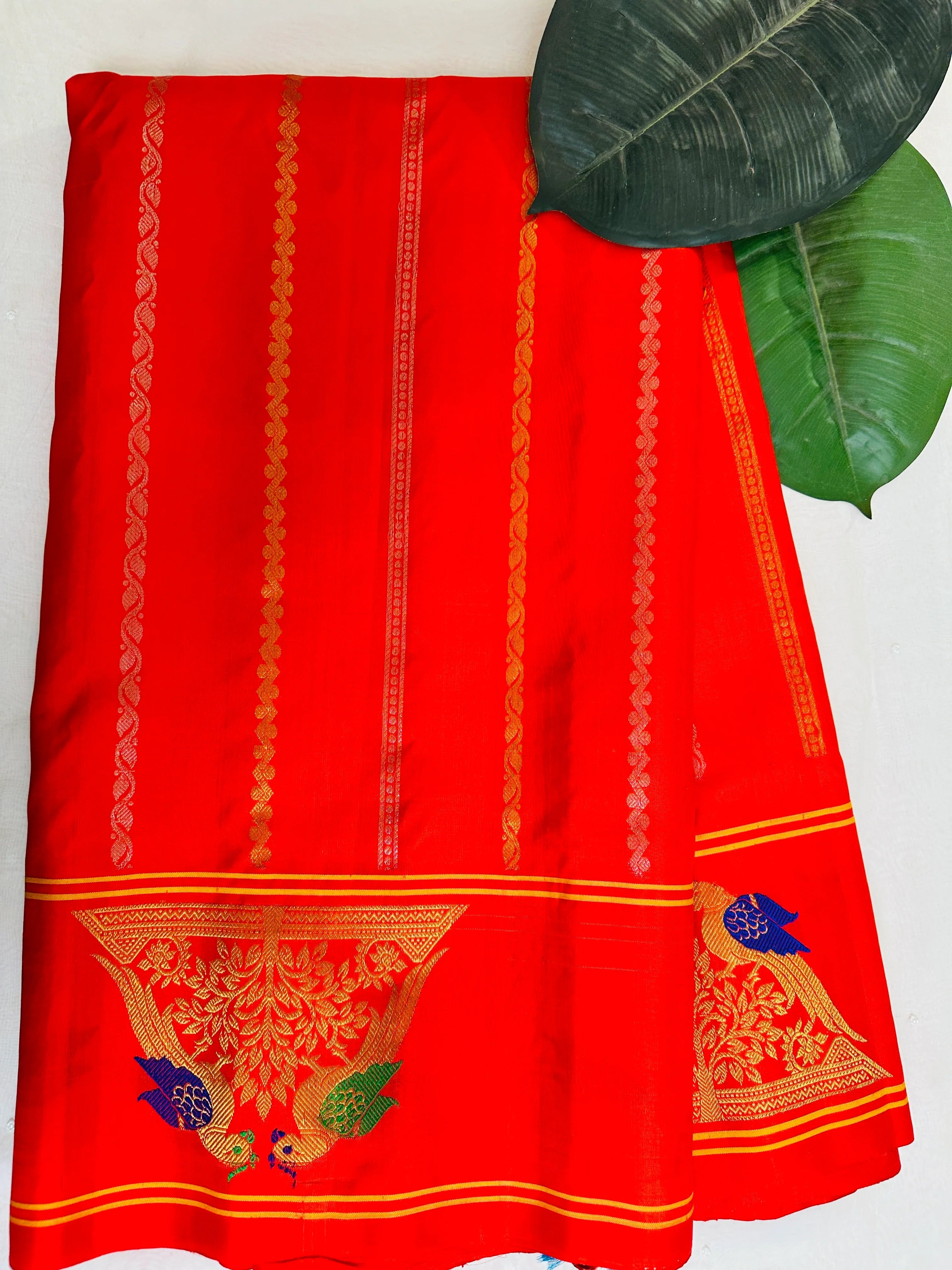 Radiant Orange Gadwal Pattu Saree Gold Zari Parrot Motifs Religious