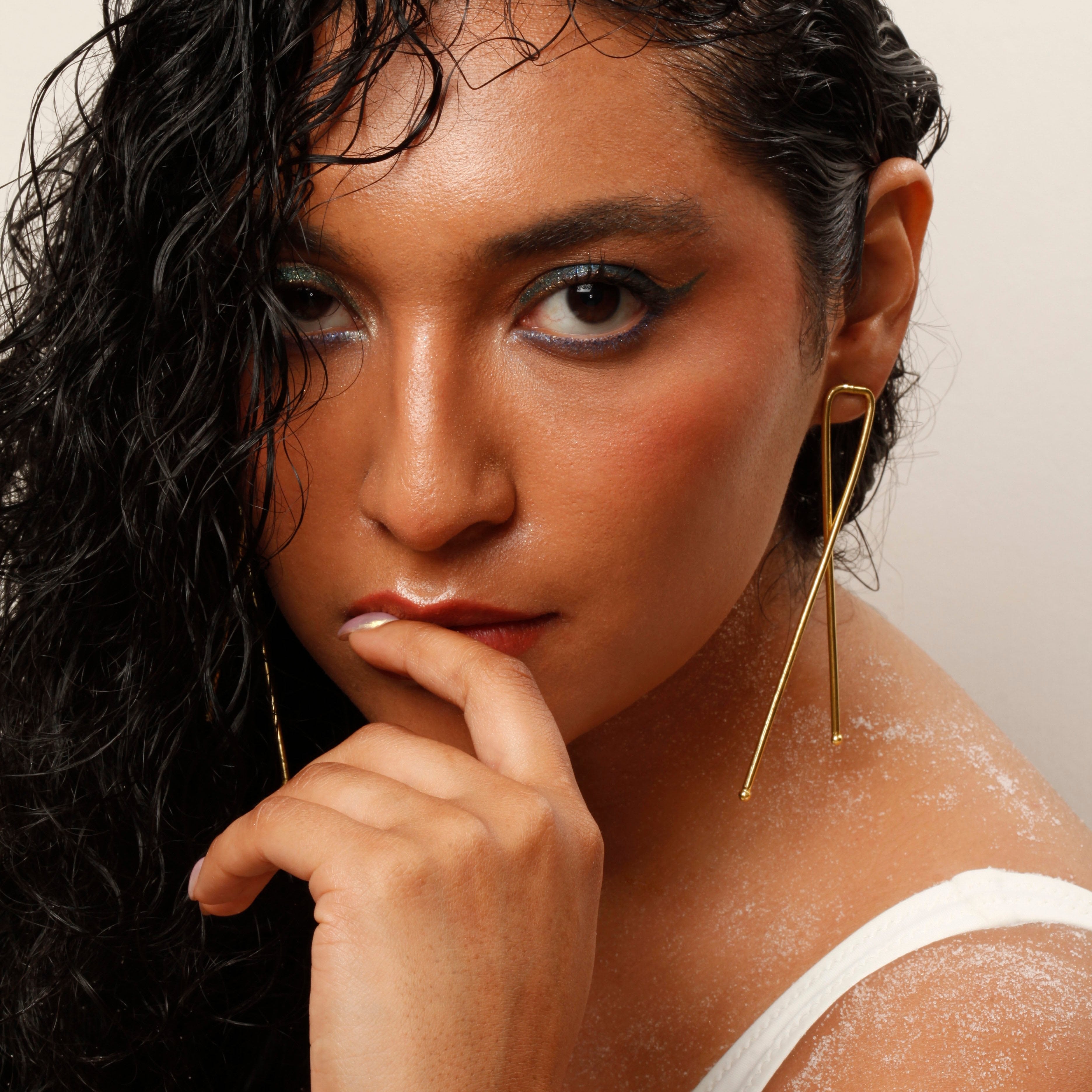 Edgy Gold Ribbon Studs Fierce Elegance