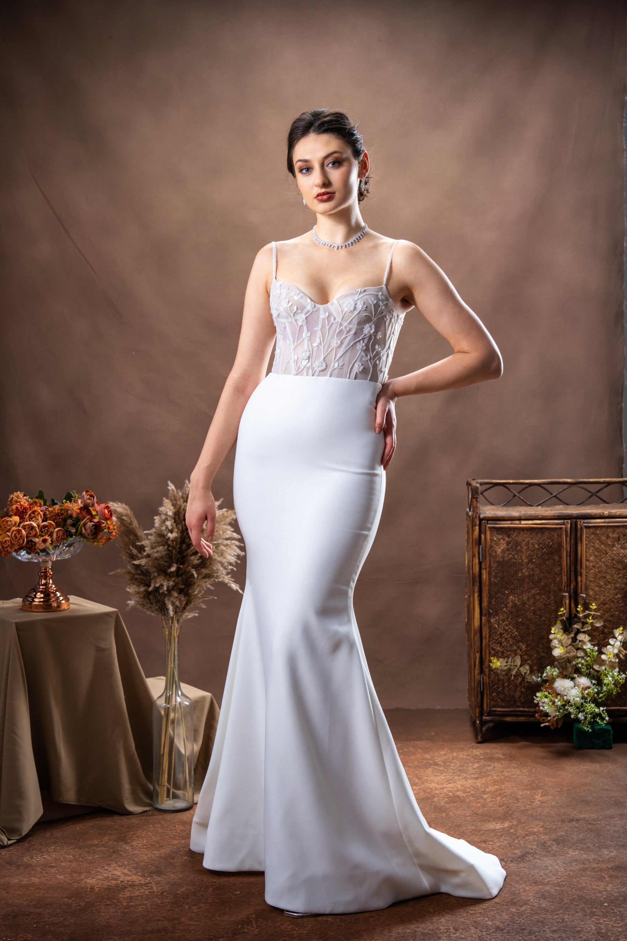 Floor-length gown with fitted bodice and gently flared skirt