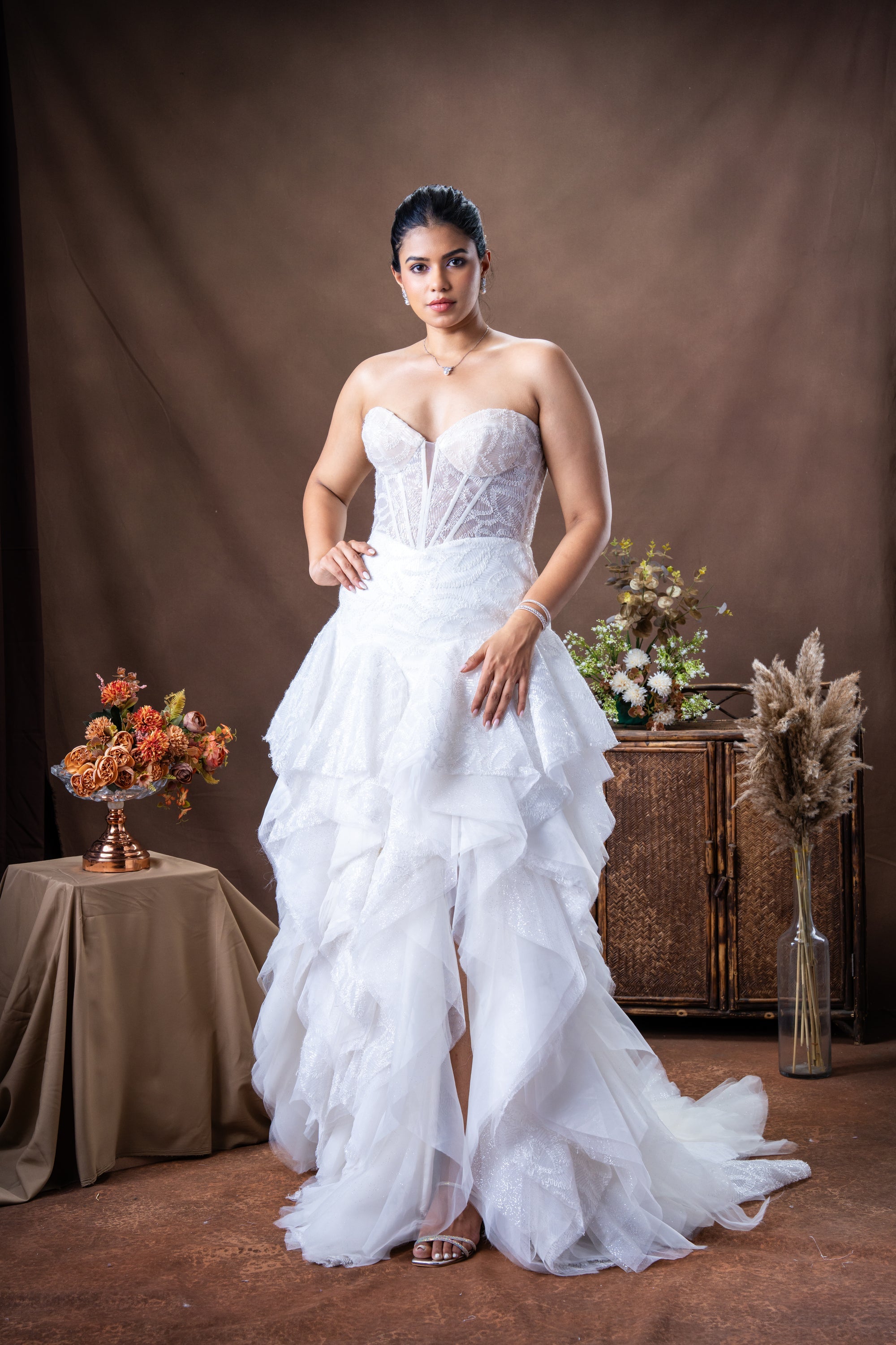 Gown with draped fabric across the bodice and straight skirt