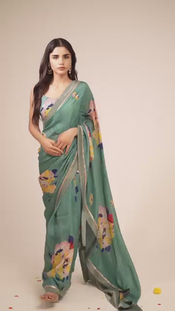 Load video: Mandhaara Nilavarna Floral Green Organza Saree